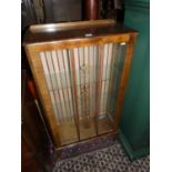 A 1950s single door glazed china display cabinet, width 61cm