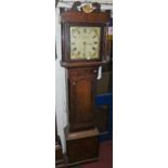 A circa 1800 provincial oak and mahogany crossbanded longcase clock, the square painted dial