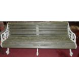 A Victorian style white painted, pierced and cast metal framed teak slatted four seater garden