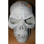 A contemporary composite stone model of a human skull, height 27cm