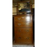 A 1930s oak swing mirror back four drawer dressing chest, width 60cm