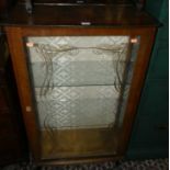 A 1950s single door glazed china display cabinet, width 61cm