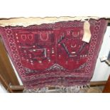 A Persian woollen red ground prayer rug