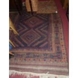 A Persian blue ground Kilim rug, having central lozenge ground within trailing tramline borders to