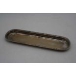An early 20th century silver pin tray, of rounded rectangular form, 3oz, makers mark rubbed,