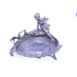An Art Nouveau spelter table centrepiece, the shaped bowl with floral decoration surmounted by