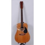 A Tanglewood model TW-1200 twelve string accoustic guitar.Condition report: Some surface marks to