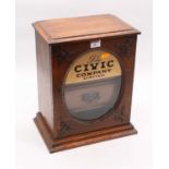 An early 20th century oak advertising table-top display cabinet inscribed 'The Civic Company Ltd' to