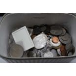 A box containing a collection of various world coins and notes