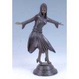 After Demétre Chiparus - a large bronzed metal figure modelled as an exotic dancer, raised on