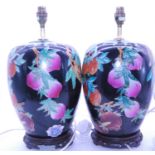 A pair of modern ceramic table lamps by Roche Bobois, each of baluster form, decorated with fruit