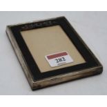 A George V silver and piqueware photograph frame, Birmingham 1925, 12 x 9.5cm,