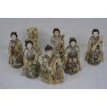 Seven Japanese okimono's, each modelled as a musician, h.18cm