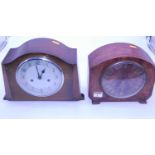 A 1950s walnut cased mantel clock having raised Roman numerals with eight day movement, width