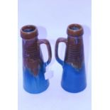 A pair of Bourne Denby Denbyware pottery ewers, each of conical form with ribbed decoration on a