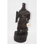 A carved softwood figure in the form of a Japanese warrior, in standing pose, h.50cm
