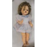 A 20th century celluloid doll having rolling blue eyes, open mouth and bent limb composition body