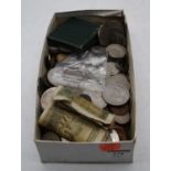 A collection of various vintage coins and bank notes