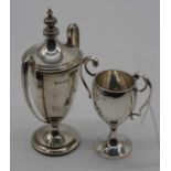 A George V silver twin handled trophy cup, Birmingham 1933, 1.4oz, h.11cm; together with one other