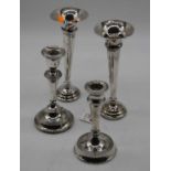 A pair of George V silver spill vases, each of trumpet shape and on loaded base, h.19cm; together
