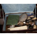 A brown leather case and contents to include silver plated goblets, silver plated card waiter, cased