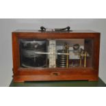 An early 20th century mahogany cased barograph, the central ivory scale marked CF Cassella & Co