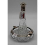 A modern silver mounted cut glass ashtray, stamped 925, dia.16cm; together with a similar bottle,