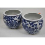 A pair of Chinese export blue and white jardinieres, each of squat circular form, underglaze