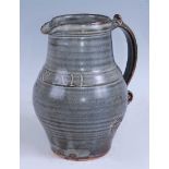 Leach Pottery of St Ives - a studio pottery jug, inscribed 'One & All', partially glazed in tones of