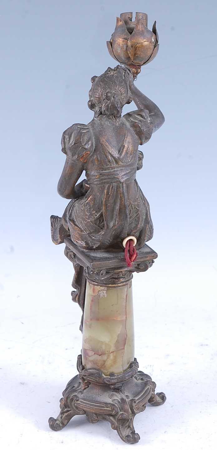 A French Art Nouveau spelter and onyx table lamp, modelled in the form of a seated maiden issuing - Image 4 of 5