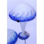 An Art de France mottled glass table lamp with mushroom shade raised on shoulder tapering column