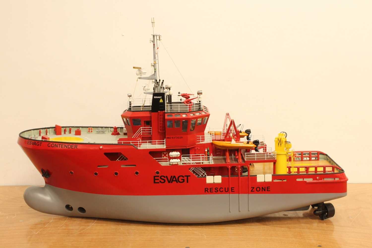 A scratch-built wooden and grp hulled model of an Esvagt Rescue/Supply Boat, finished in red and