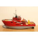 A scratch-built wooden and grp hulled model of an Esvagt Rescue/Supply Boat, finished in red and