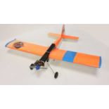 A kit-built balsawood and four stoke radio-controlled aircraft, comprising of balsawood fuselage and