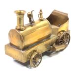 Early 20th-century brass dribbler type locomotive, spirit fired example, with on/off lever, 2 wick