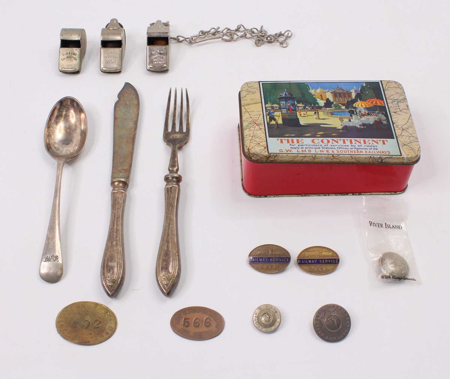 Collection of mixed railway related items to include LNER Cutlery, various railway whistles, badges,