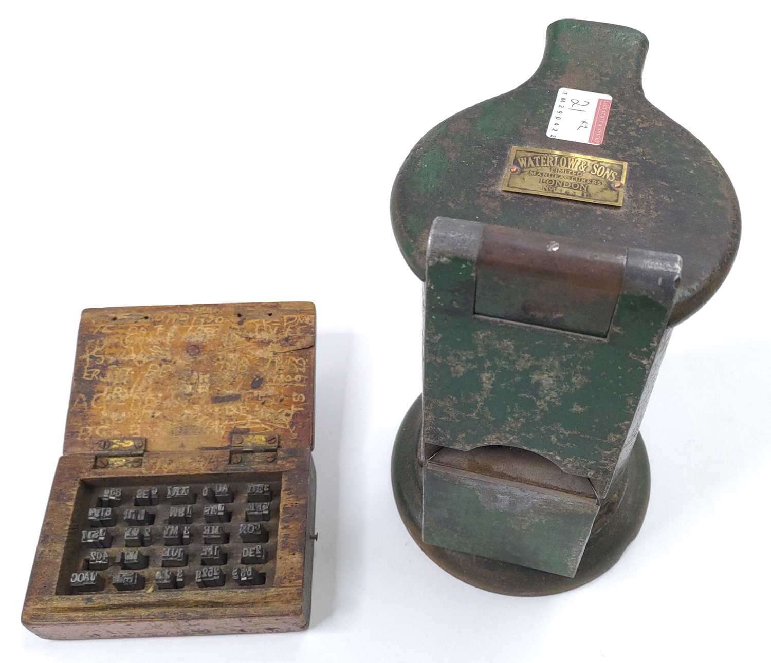 A Waterlow Ticket dating press, with a wooden box of matching types