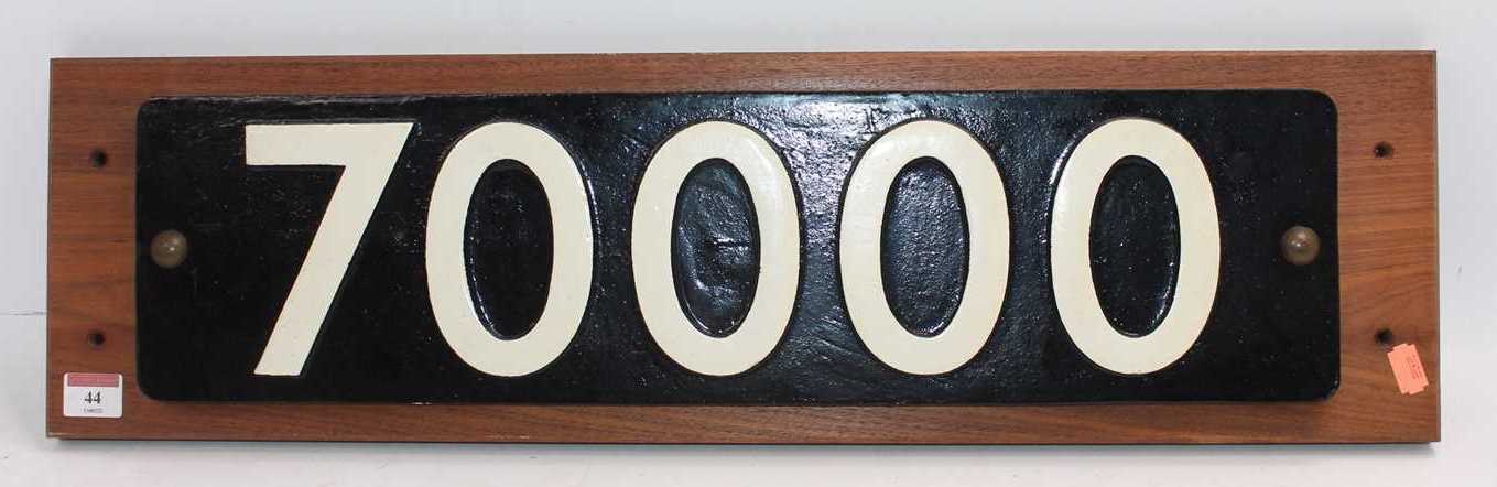 A reproduction cast metal Brittania Class locomotive smoke box number plate, No.70000, mounted on