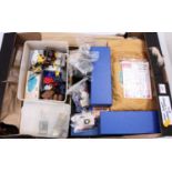 A large tray containing many items from a modeller’s workshop including a few brass kits, some