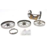 Box containing a collection of live steam portable engine parts, to include 4 spoked wheels,