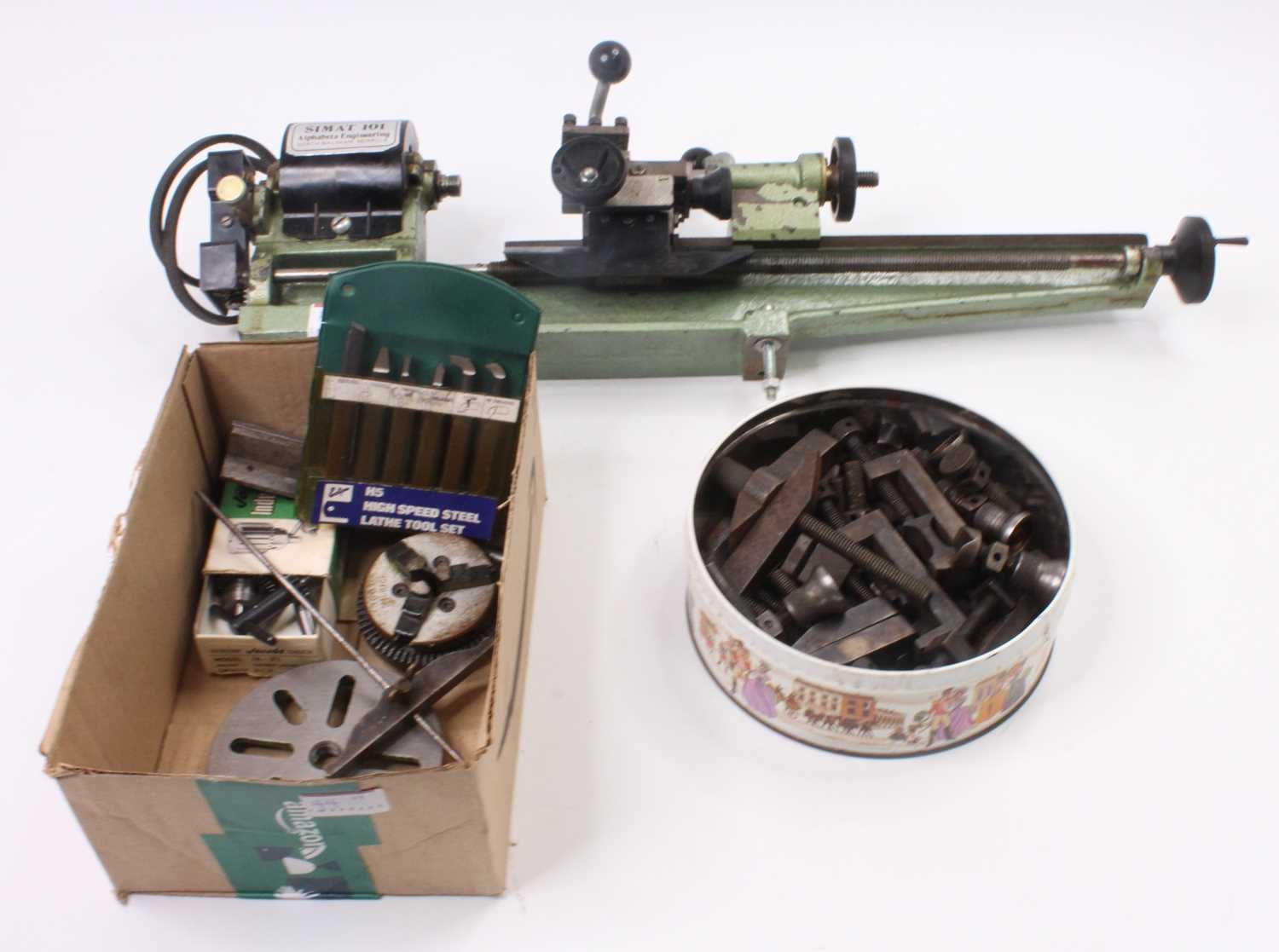 Simat 101 Alpha Beta Engineering table top lathe and accessories, to include face plate, drill bits,