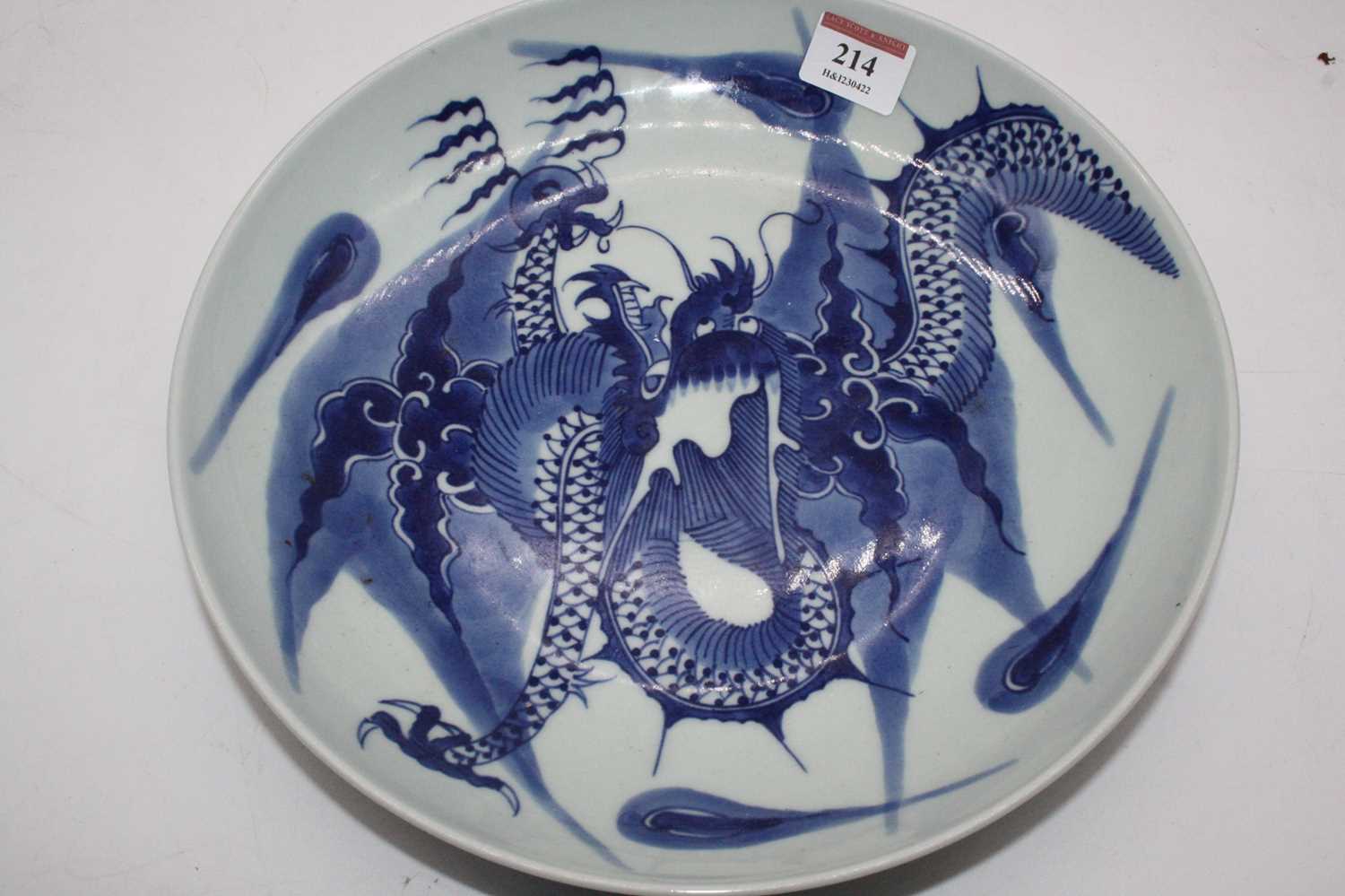 A Chinese export blue & white dish underglaze blue decorated with a four claw dragon chasing a - Image 3 of 3