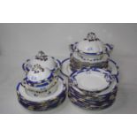 A Victorian Daniell part dinner service, on a white ground with blue borders and heightened in gilt,