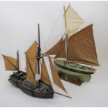 A 20th century hand built model of a ship, height 56cm, together with another similar