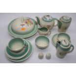 A 1930s Susie Cooper Crown Burslem Works part tea service on a cream and green ground with floral