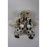 A collection of six Staffordshire pottery flat back models of spaniels, largest 31cm highAll are