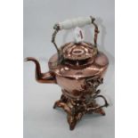 A Victorian copper spirit kettle on stand having milk glass handles, 40cm high