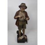 A continental pottery figure of a boy, height 56cmHe has been smashed at the shins and restored.