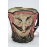 A Royal Doulton double-sided character jug Mephistopheles, having printed lion and crown mark verso,