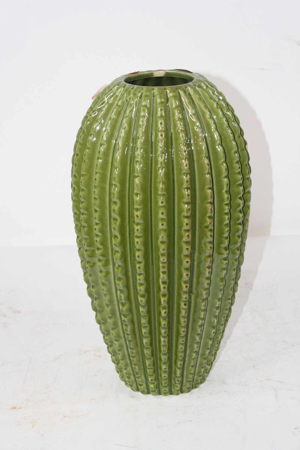 A large green glazed ceramic vase of cactus shape, height 38cm